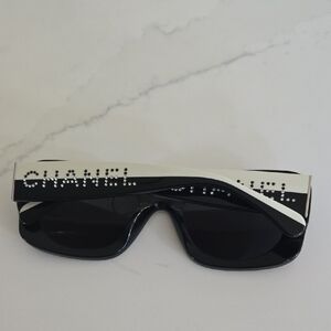 CHANEL Black Sunglasses with White Accents and Crystal Logo